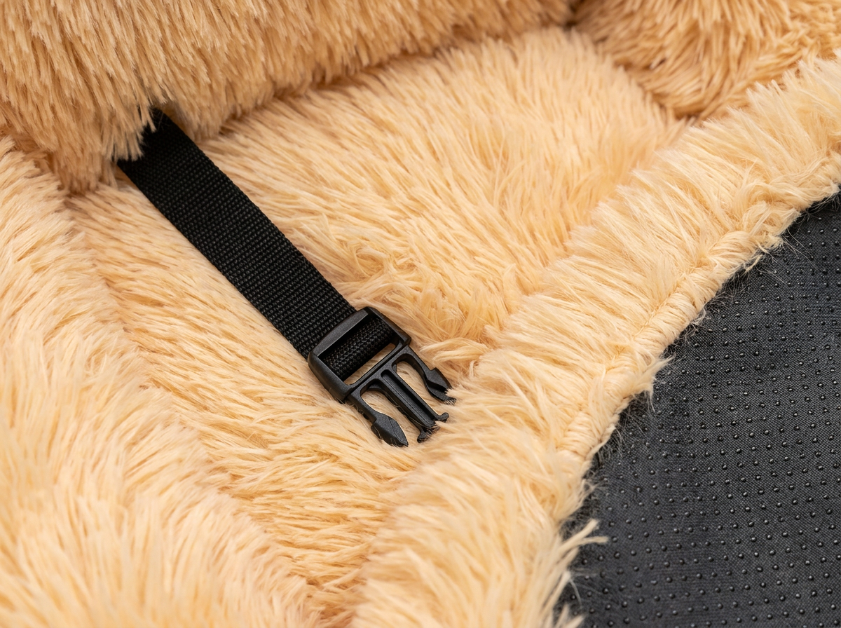 Macro of the Rove cat car seat: plush shag fur, safety-strap buckle and non-slip base